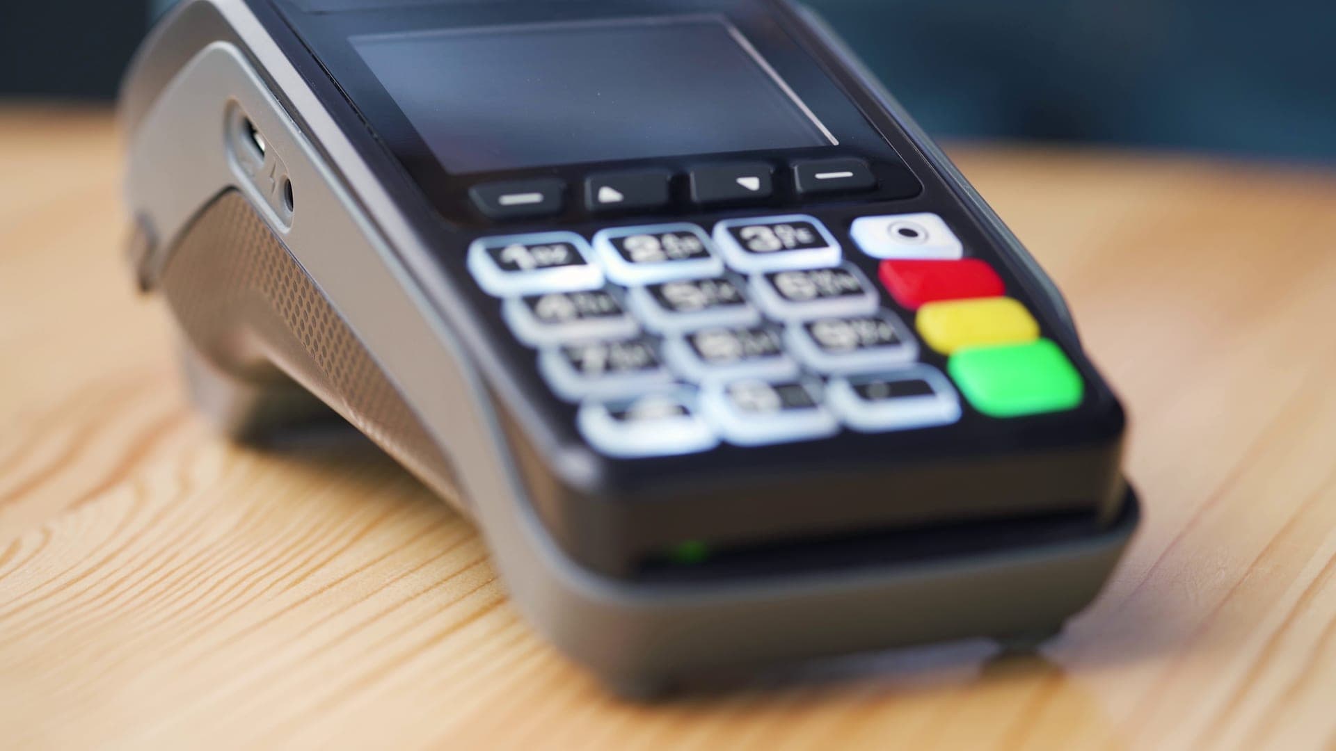 Woman making contactless credit card payment