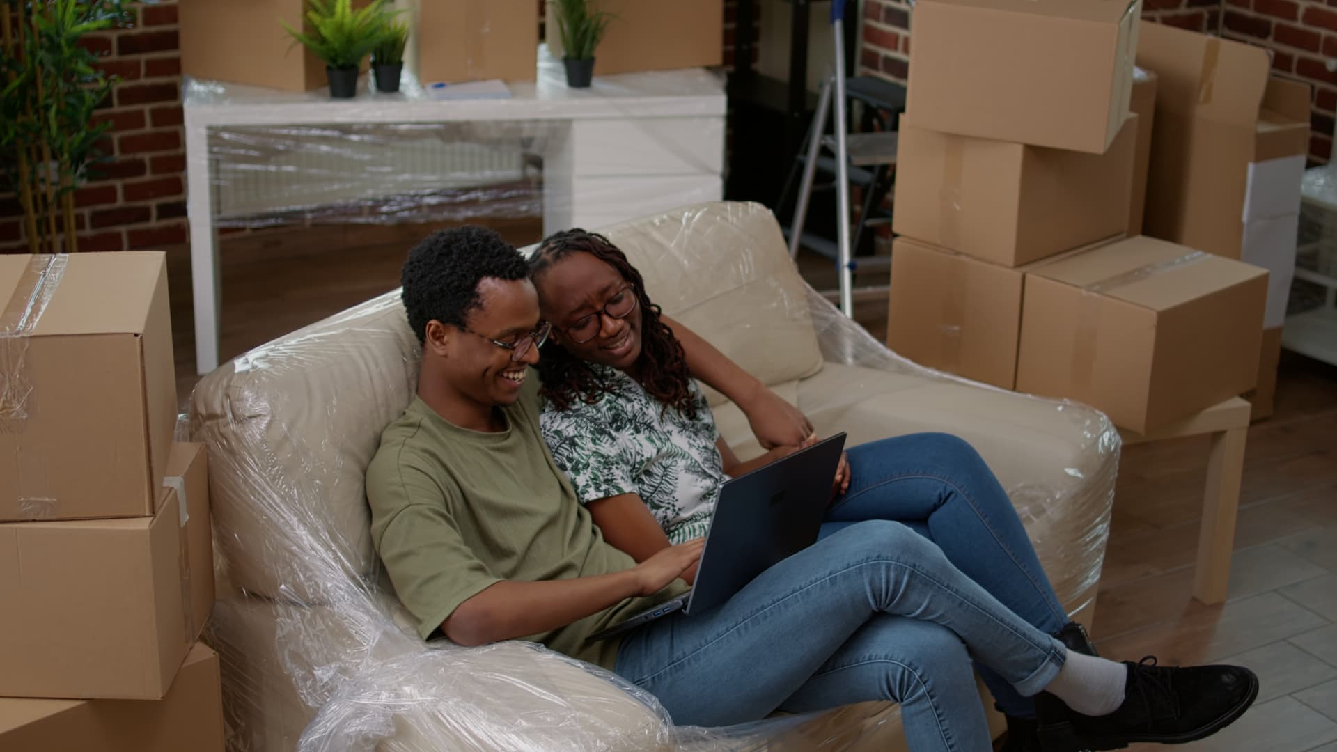 Couple shopping online for home purchases