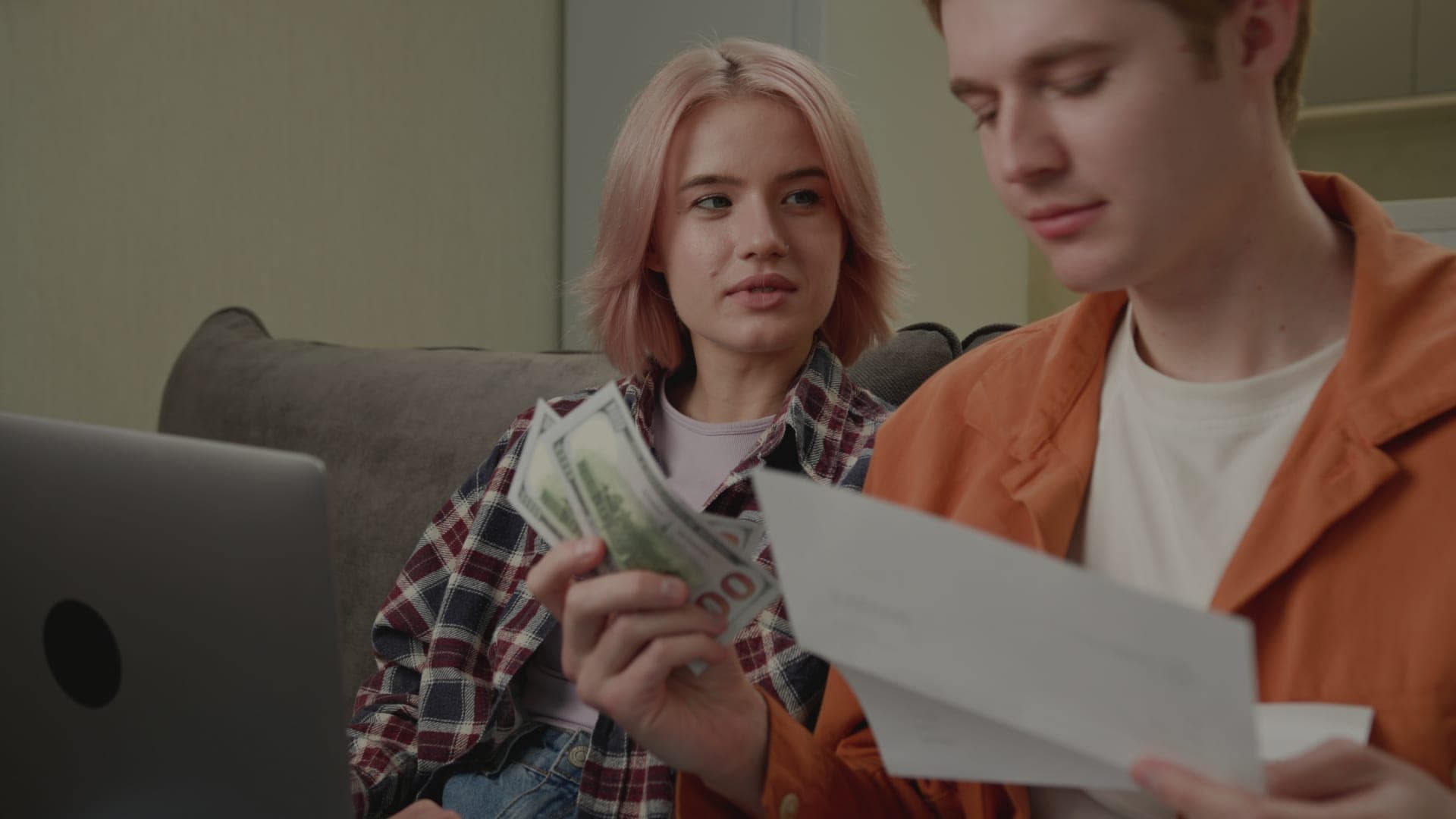 A family reviewing bills together.