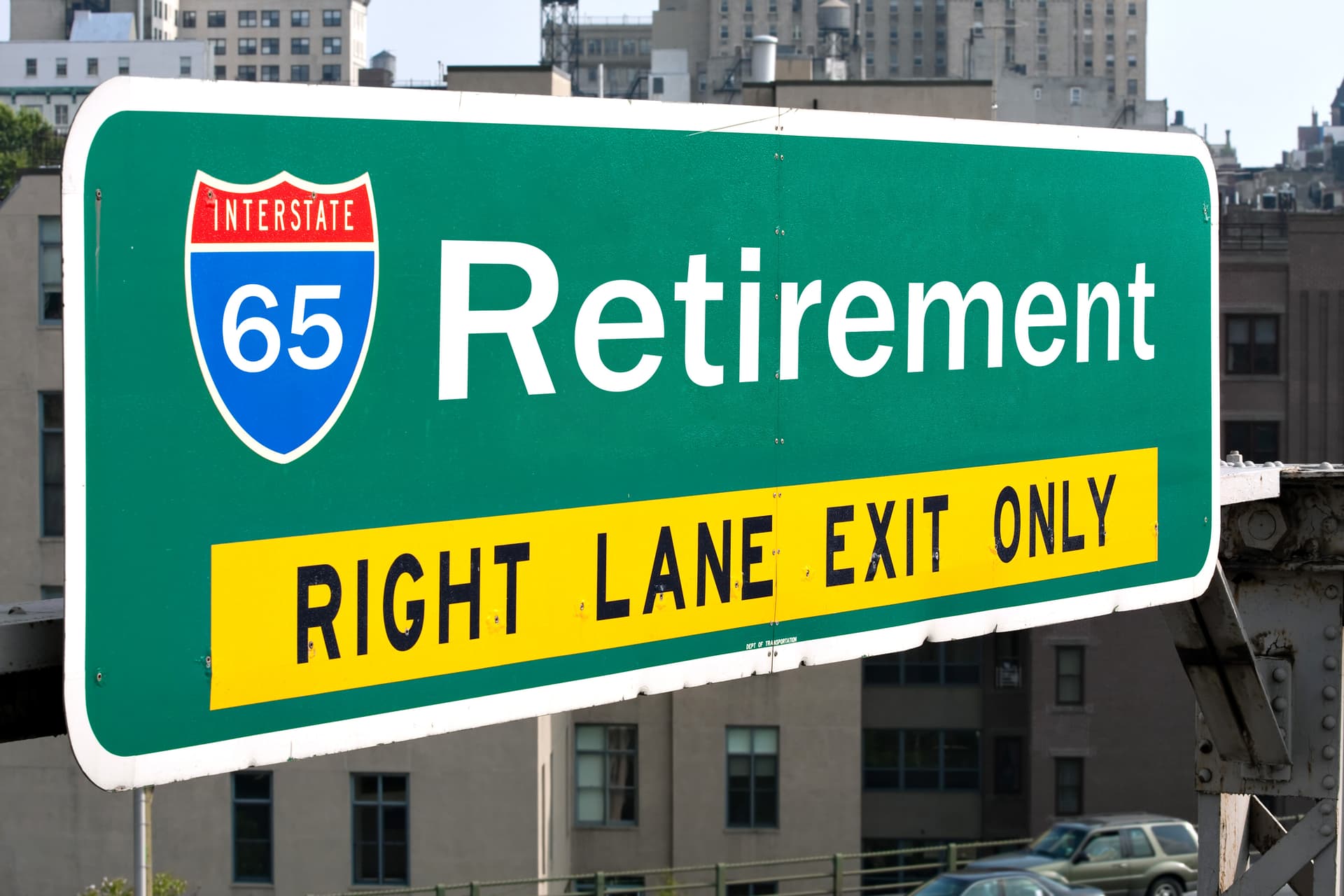 Highway sign showing Retirement Ahead at age 65