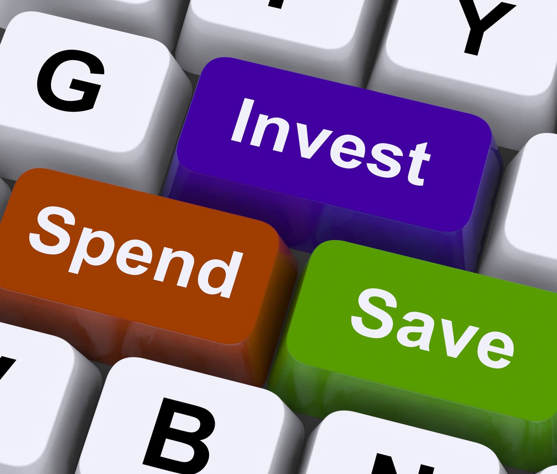 Keyboard keys labeled save, spend, and invest