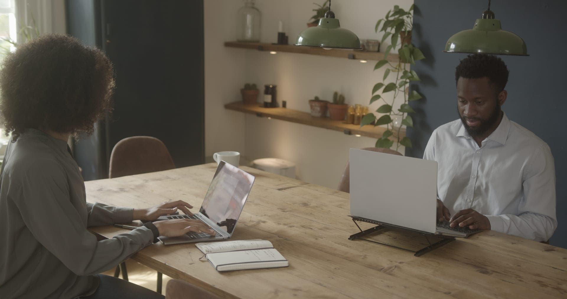 A couple reviewing a financial plan together at home.